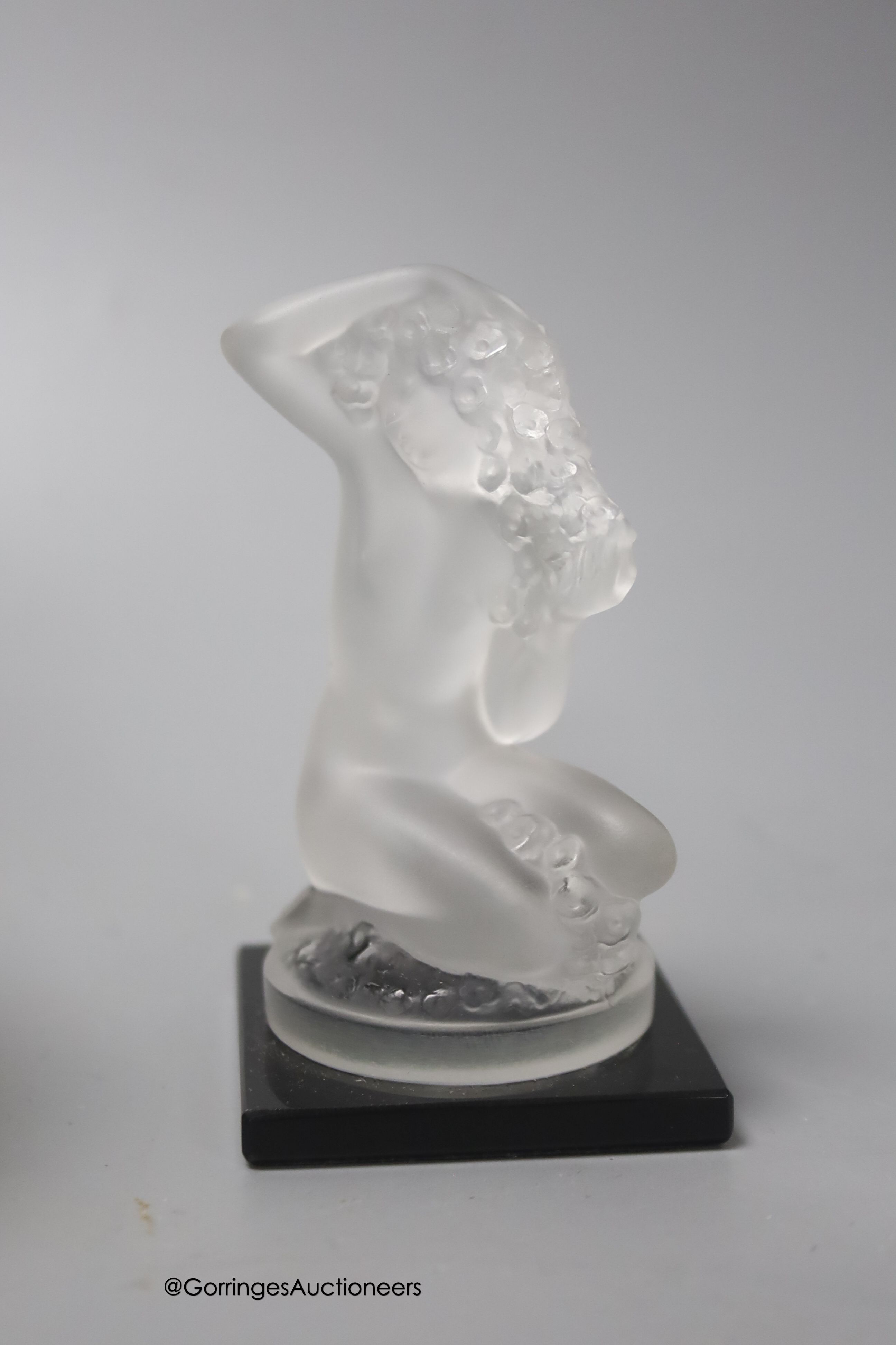 A Sabino opaline glass ashtray, 16cm, a similar Sabino moulded posy vase, one other French posy vase and a small French frosted glass kneeling female model